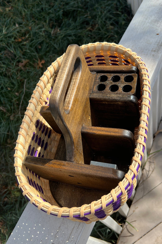 Wooden tool holder with purple accents on a wooden surface